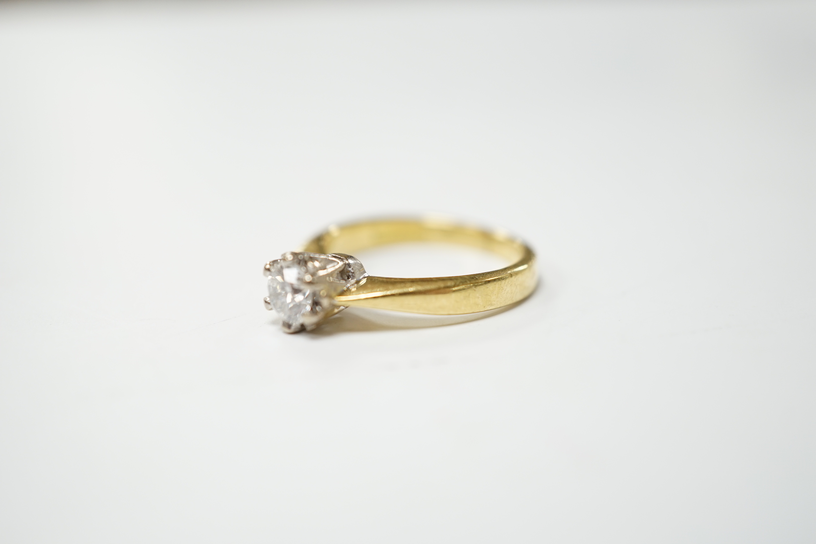 A modern 18ct gold and solitaire diamond set ring, the stone weighing 0.33ct, size I, gross weight 4.2 grams.
